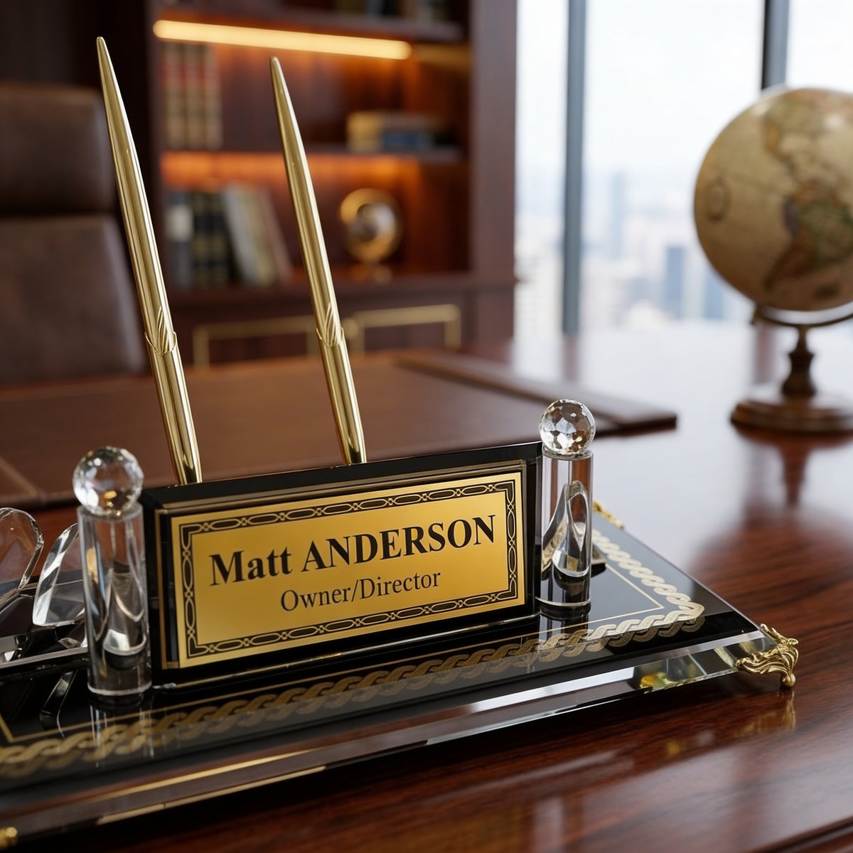 Black glass desk name plate with gold pens and engraved plate